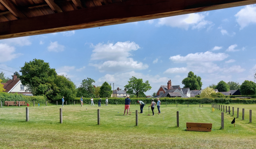 Croquet Club playing croquet on the playing field